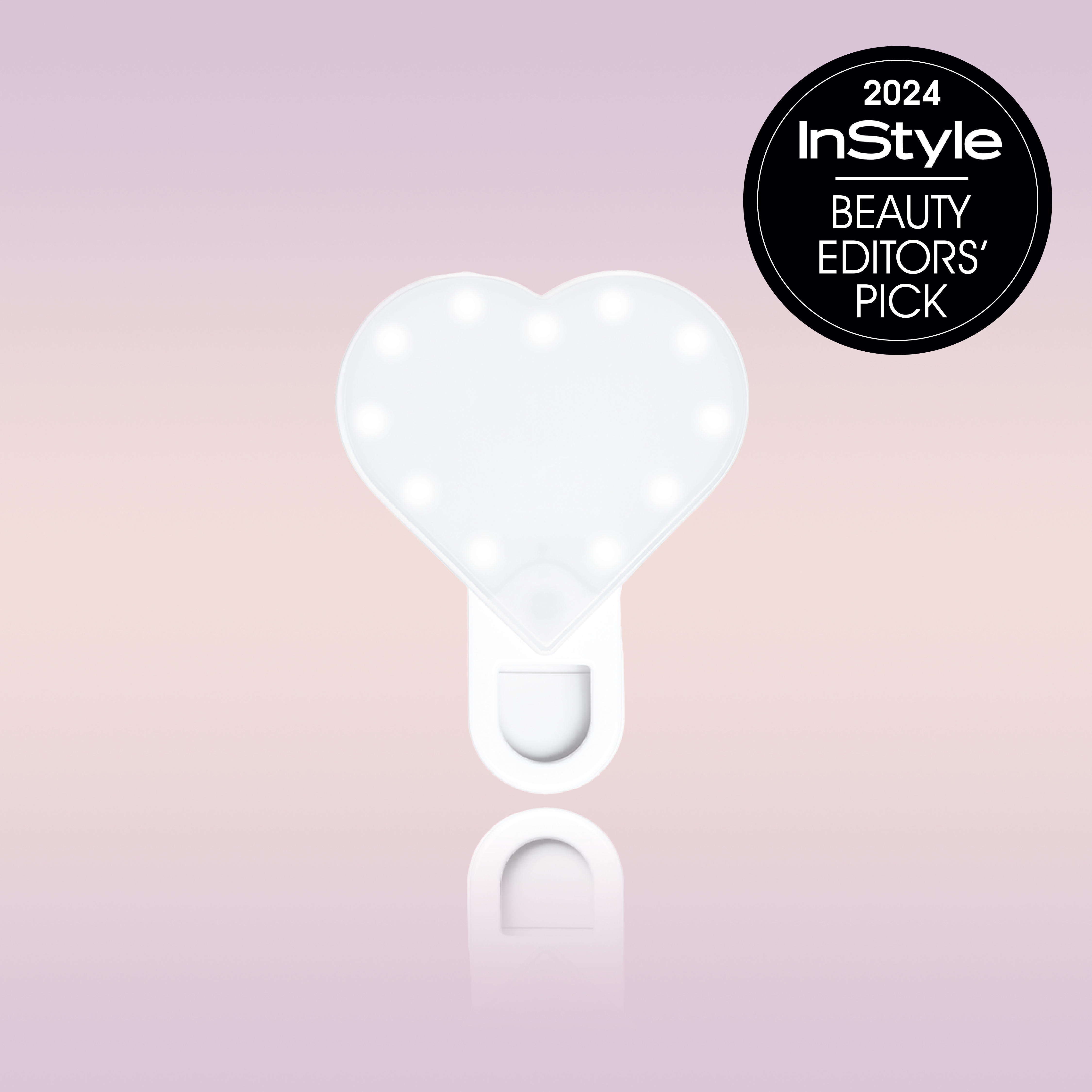 Experience the RIKI Sweetheart Clip-On Selfie Light with Makeup Mirror by Riki Loves Riki. Achieve flawless lighting for your selfies and makeup application. Shop now your own Alix Earle Selfie light today!