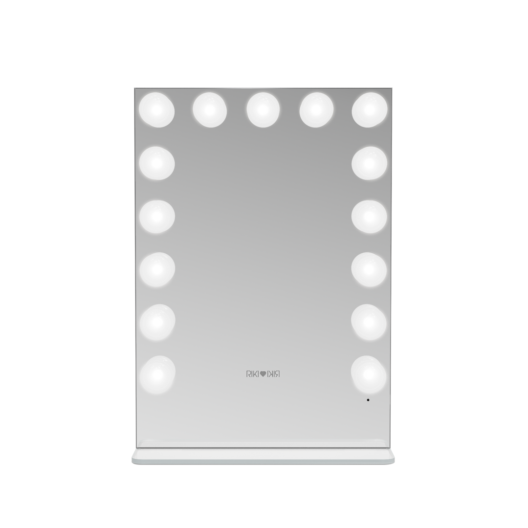 Side view of the small Riki Loves Riki Hollywood mirror with cool light.
