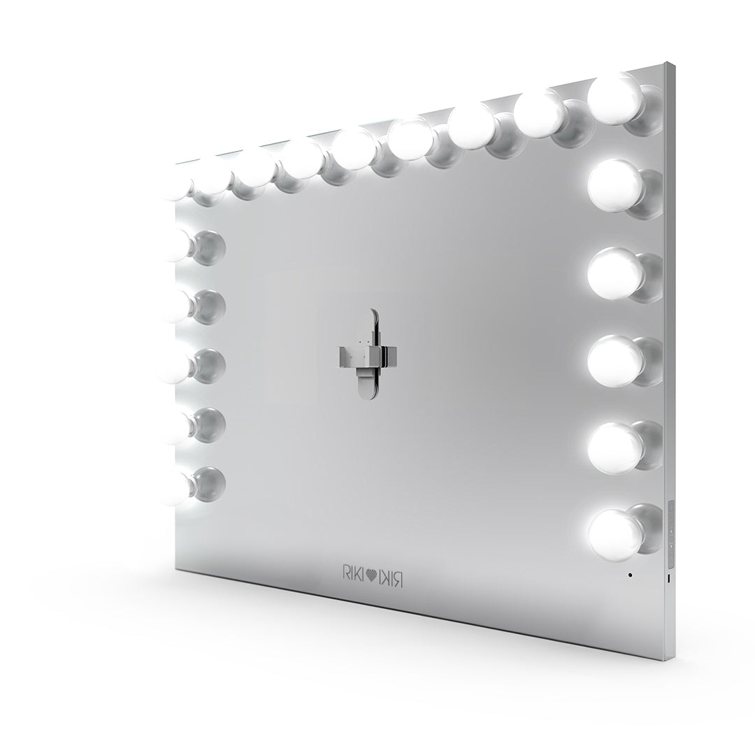 Riki Loves Riki Hollywood mirror in silver featuring a magnetic phone holder for perfectly illuminated photos and videos.