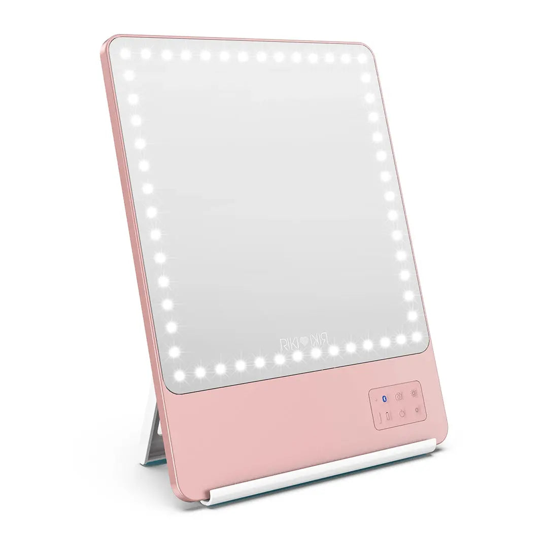 Rose gold RIKI SKINNY portable LED makeup mirror on its stand