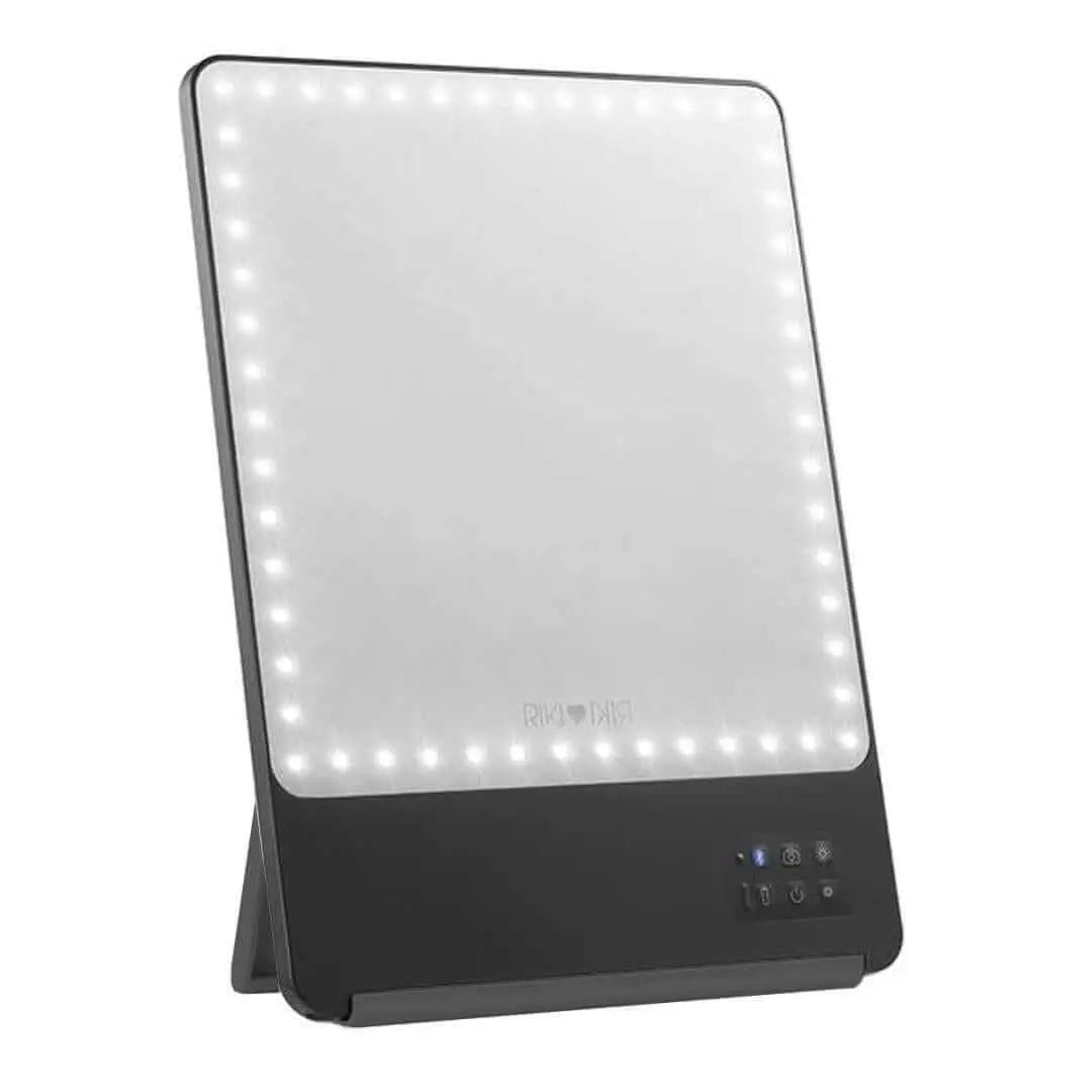 Stylish black RIKI SKINNY mirror with 10x magnification, front view, sample sale.