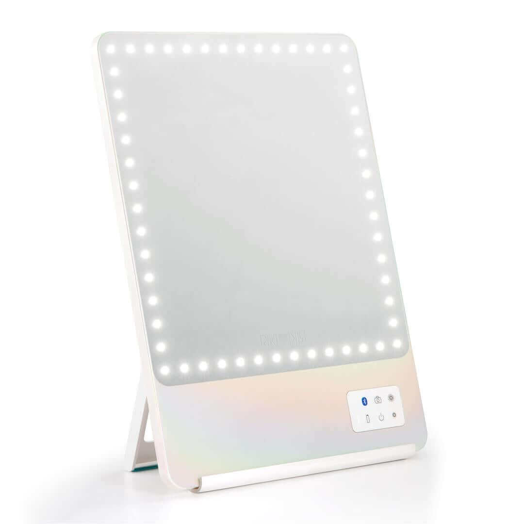 Front view of iridescent RIKI SKINNY mirror with 10x magnification, slightly used, sample sale.