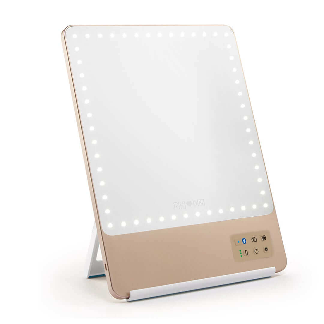 Champagne gold RIKI SKINNY mirror with 10x magnification, front view, sample sale.