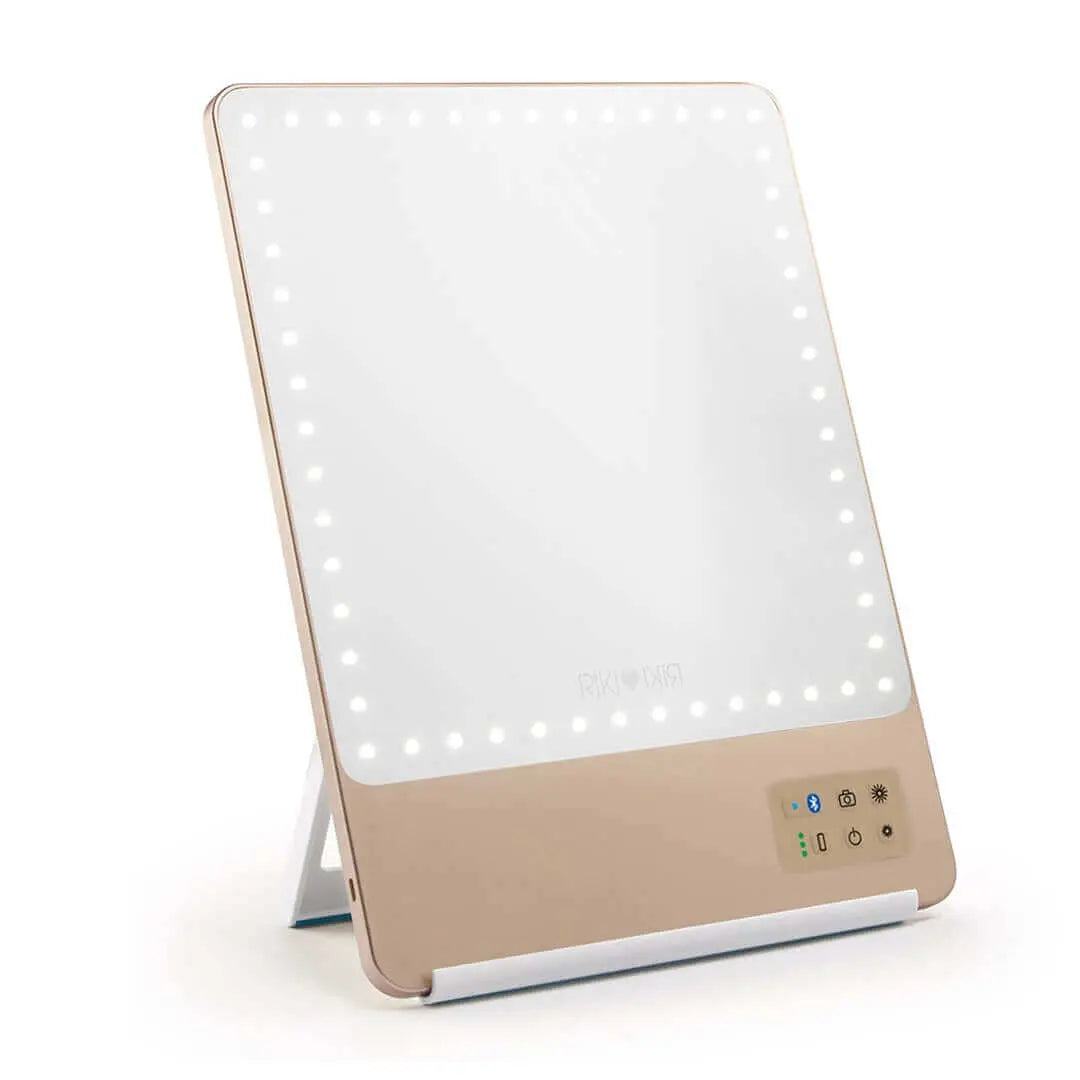 Champagne gold RIKI SKINNY mirror with 10x magnification, front view, sample sale.