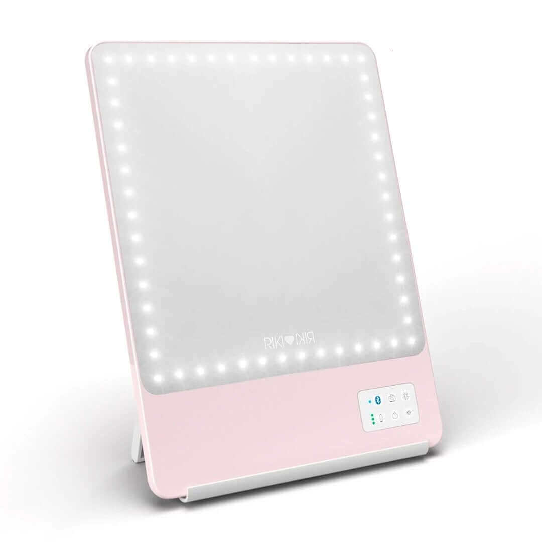 Pretty in pink RIKI SKINNY mirror with 10x magnification, front view, slightly used, sample sale.