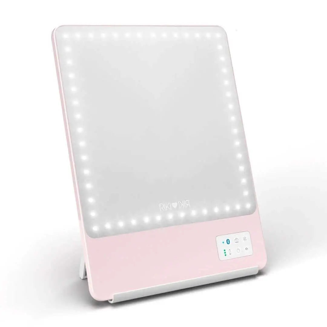 Pretty in pink RIKI SKINNY mirror with 10x magnification, front view, slightly used, sample sale.