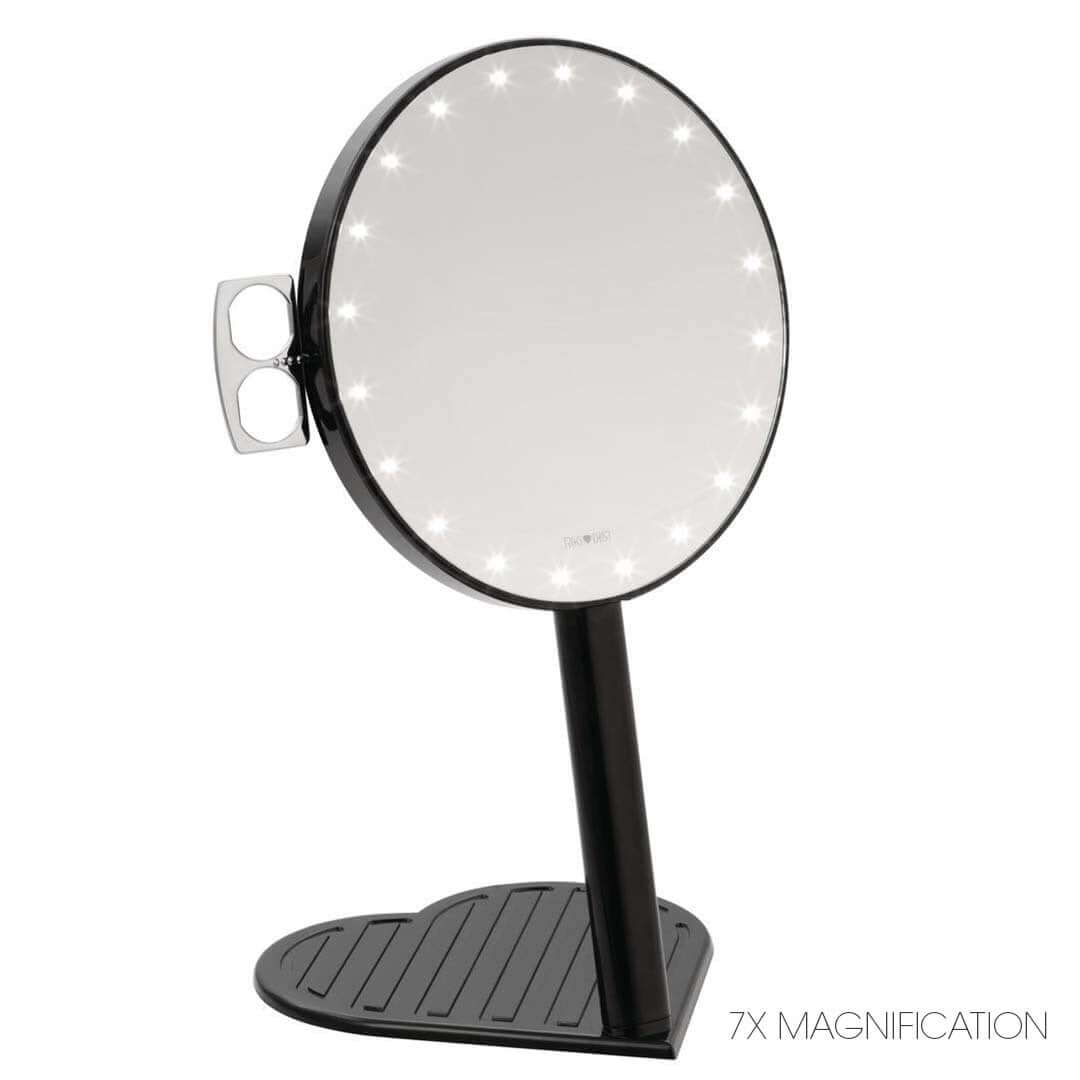 The RIKI GRACEFUL compact vanity mirror in champagne gold, featuring a 7X magnifying handheld mirror with LED lights and a heart-shaped base.