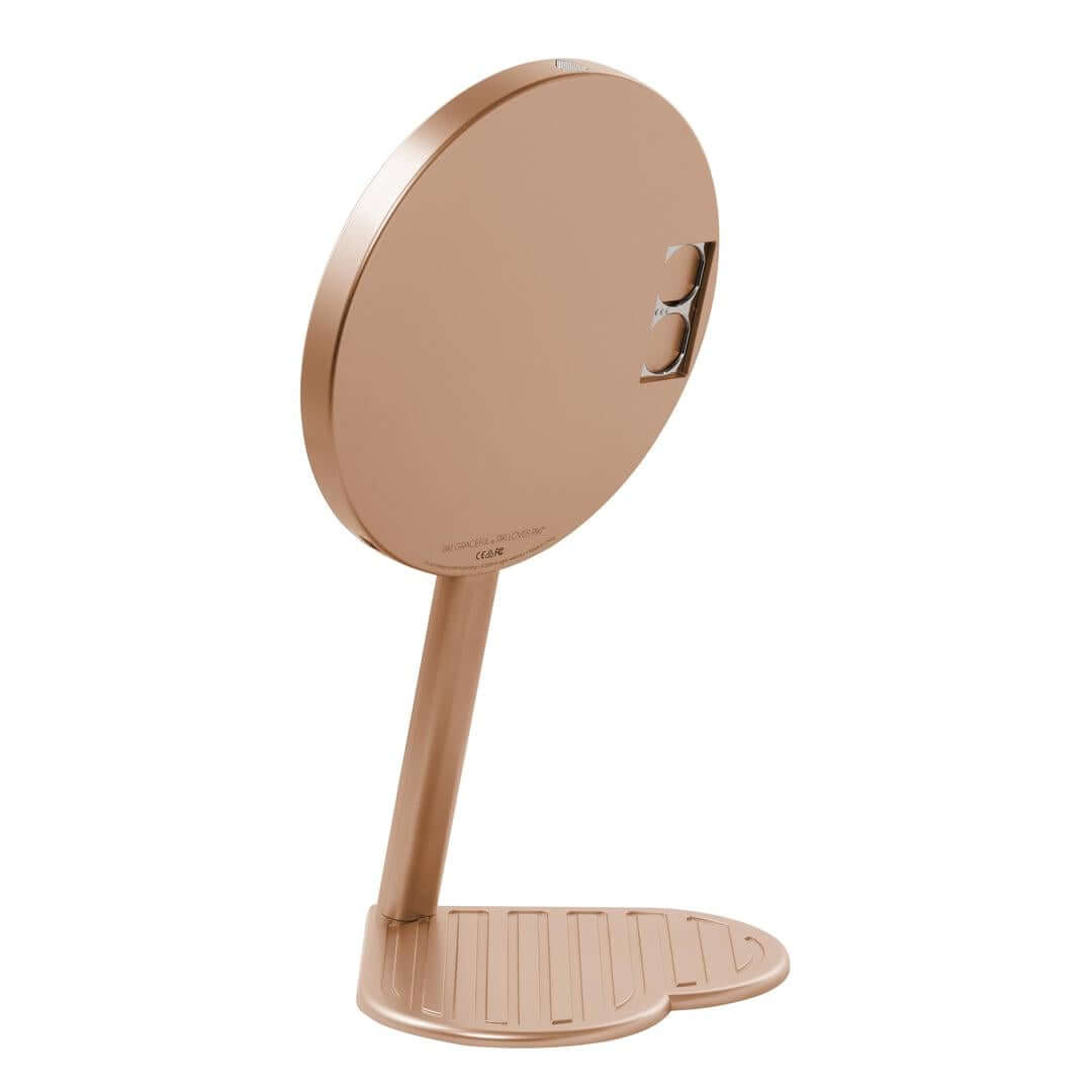 The RIKI GRACEFUL handheld magnifying face mirror in rose gold with 7X magnification and LED lights.