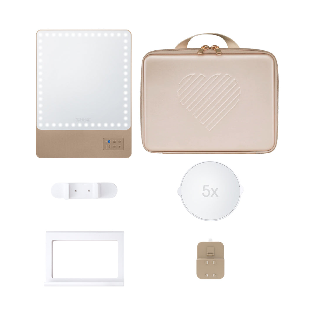 Travel glamorously with the RIKI Babe Travel Set in Champagne Gold. Includes the RIKI SKINNY mirror with daylight LED lighting and a 5x magnifying mirror, ensuring you always look your best!