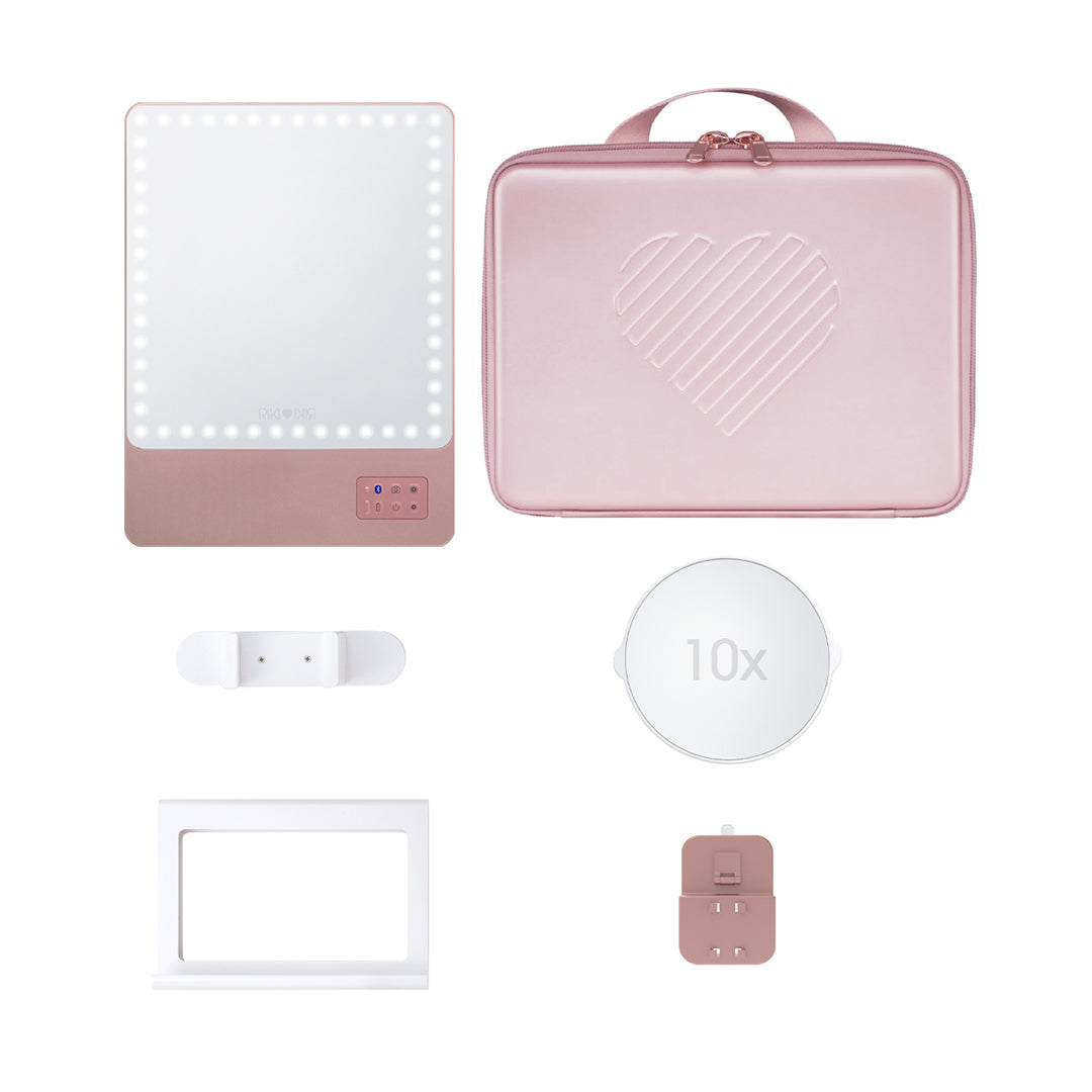 Travel chic with the RIKI Babe Travel Set in Rose Gold. Includes the RIKI SKINNY mirror, a 10x magnifying mirror, and a carry bag for impeccable makeup results wherever your adventures take you!