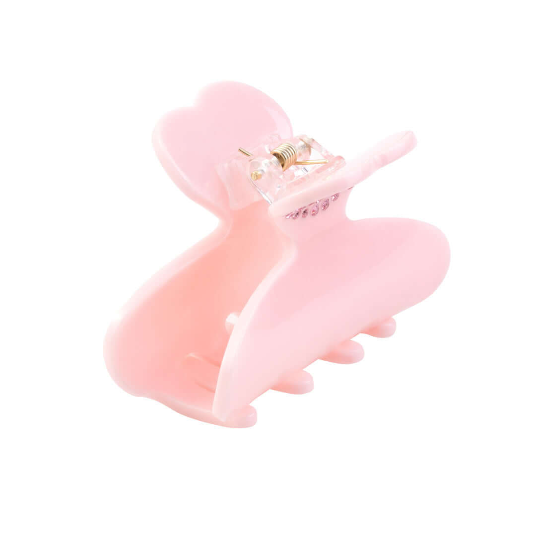 Pink RIKI Hair Clip adorned with crystal hearts, perfect for adding a touch of glam to any outfit.