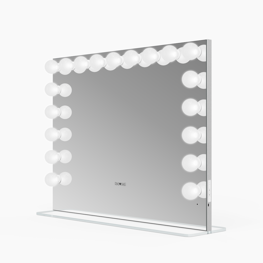 Side view of the large Riki Loves Riki Hollywood mirror with cool light.