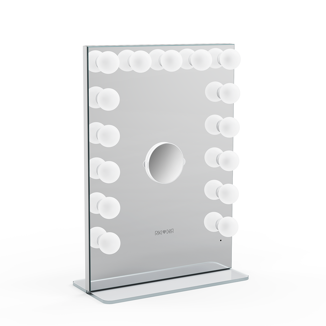 Vertical Riki Loves Riki Hollywood mirror in silver with a magnifying mirror for detailed makeup.