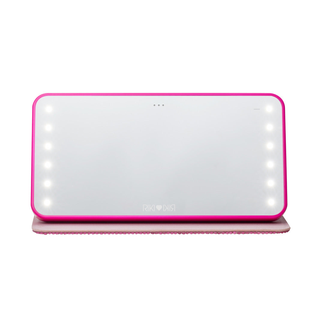 Front view of the hot pink Sparkle RIKI Powerful LED-lighted mirror and power bank by RIKI LOVES RIKI, showcasing elegance and style in every touch-up.