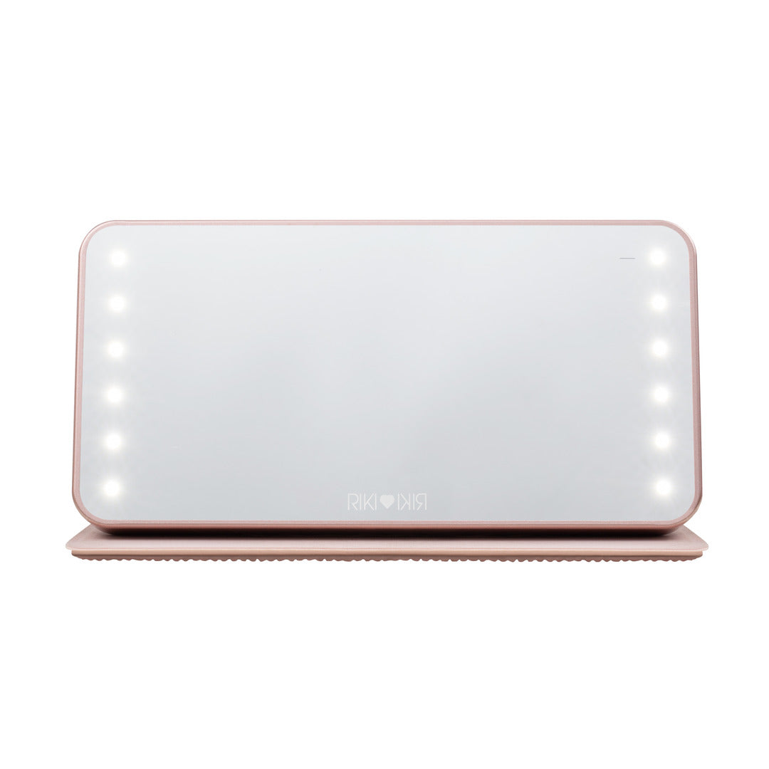 Front view of the Sparkle RIKI Powerful LED-lighted mirror and power bank in  rose gold by RIKI LOVES RIKI, perfect for flawless makeup application with a light up travel mirror.
